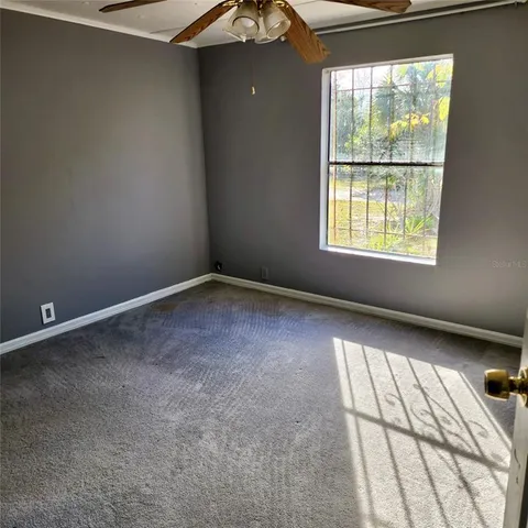 a white toilet sitting next to a bathroom sink and a shower