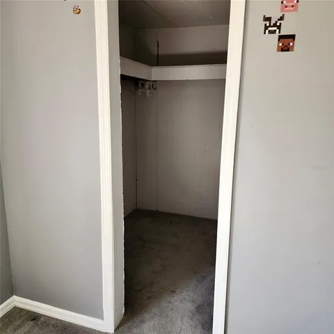 a bathroom with a shower curtain and sink