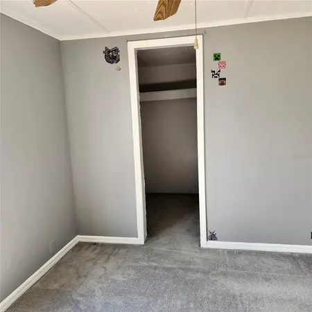 a bathroom with a shower curtain and sink