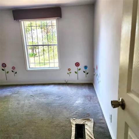 a view of a street with a building in the background