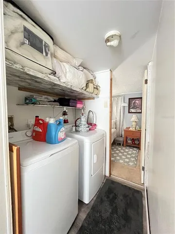 a spacious bedroom with a bed and window