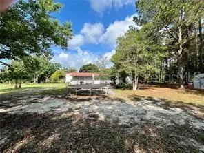a view of a yard with swimming pool