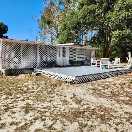 a view of a livingroom with furniture hardwood floor and a ceiling fan