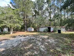 a view of backyard with outdoor space