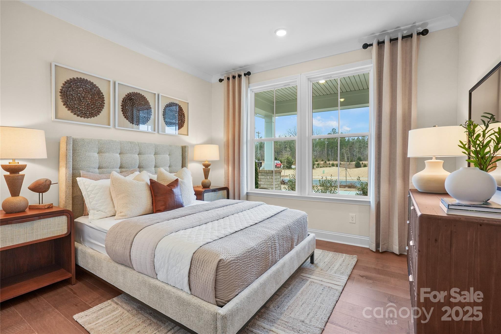 906 Kinship Drive Lancaster, SC 29720 - Photo 3 of 13 a bedroom with a large bed and a window