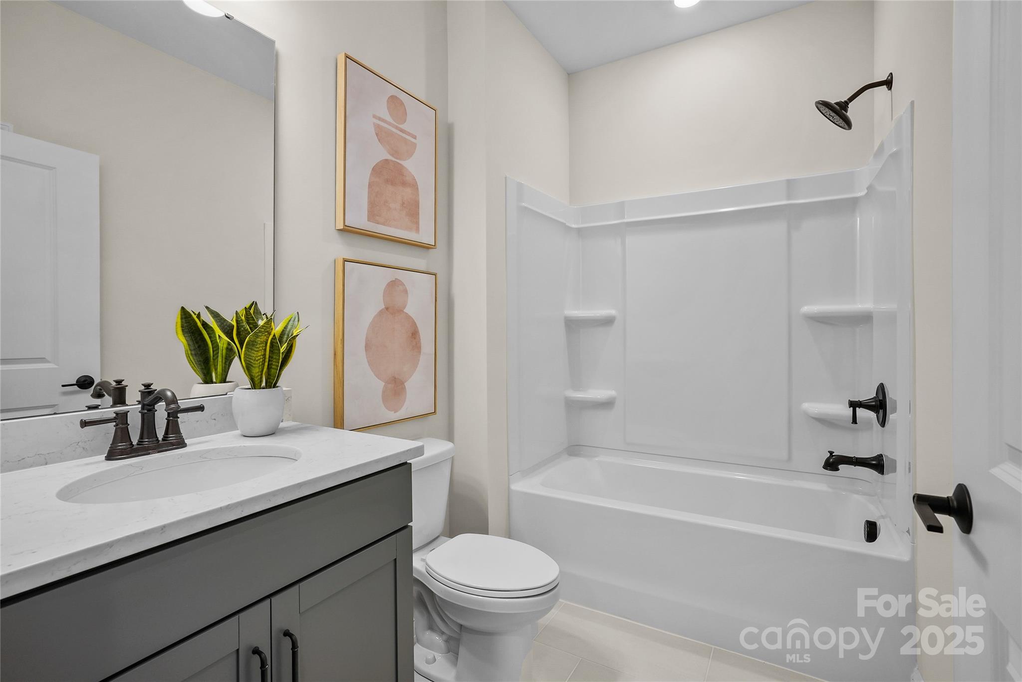 906 Kinship Drive Lancaster, SC 29720 - Photo 4 of 13 a bathroom with a sink a toilet and a bathtub