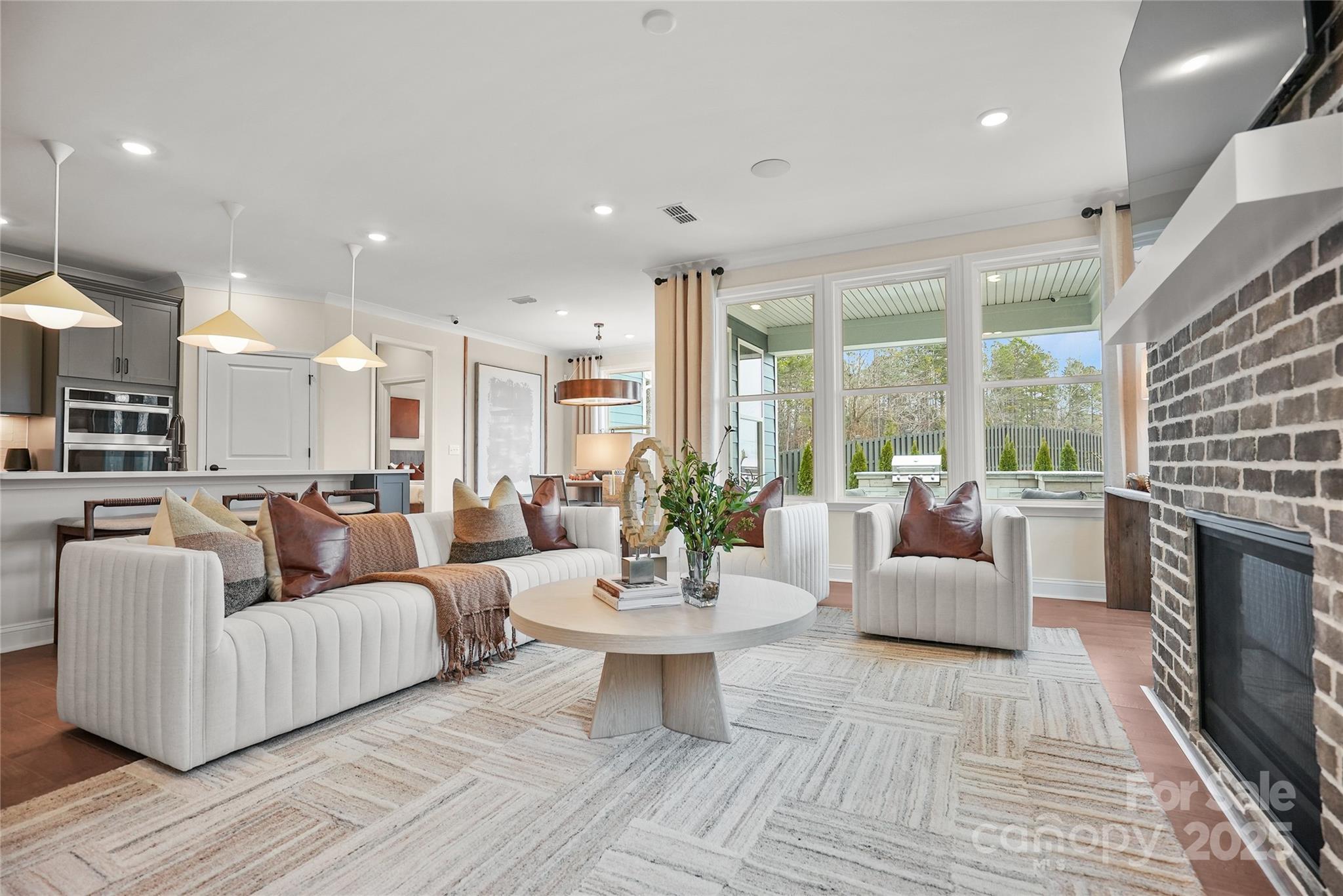 906 Kinship Drive Lancaster, SC 29720 - Photo 8 of 13 a living room with fireplace furniture and a large window