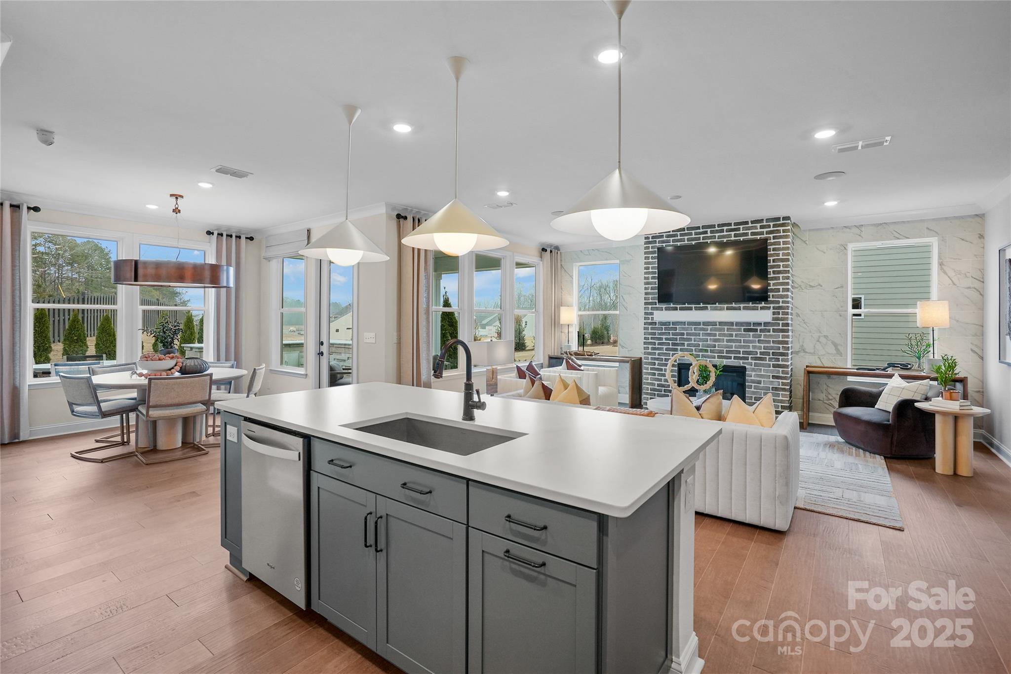 906 Kinship Drive Lancaster, SC 29720 - Photo 9 of 13 a kitchen with sink stove and living room