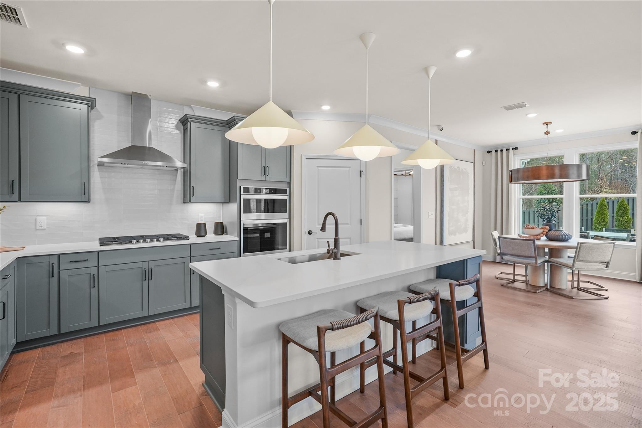 906 Kinship Drive Lancaster, SC 29720 - Photo 10 of 13 a kitchen with cabinets table and chairs