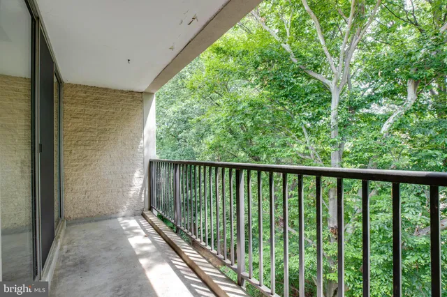 a view of a balcony with wooden floor