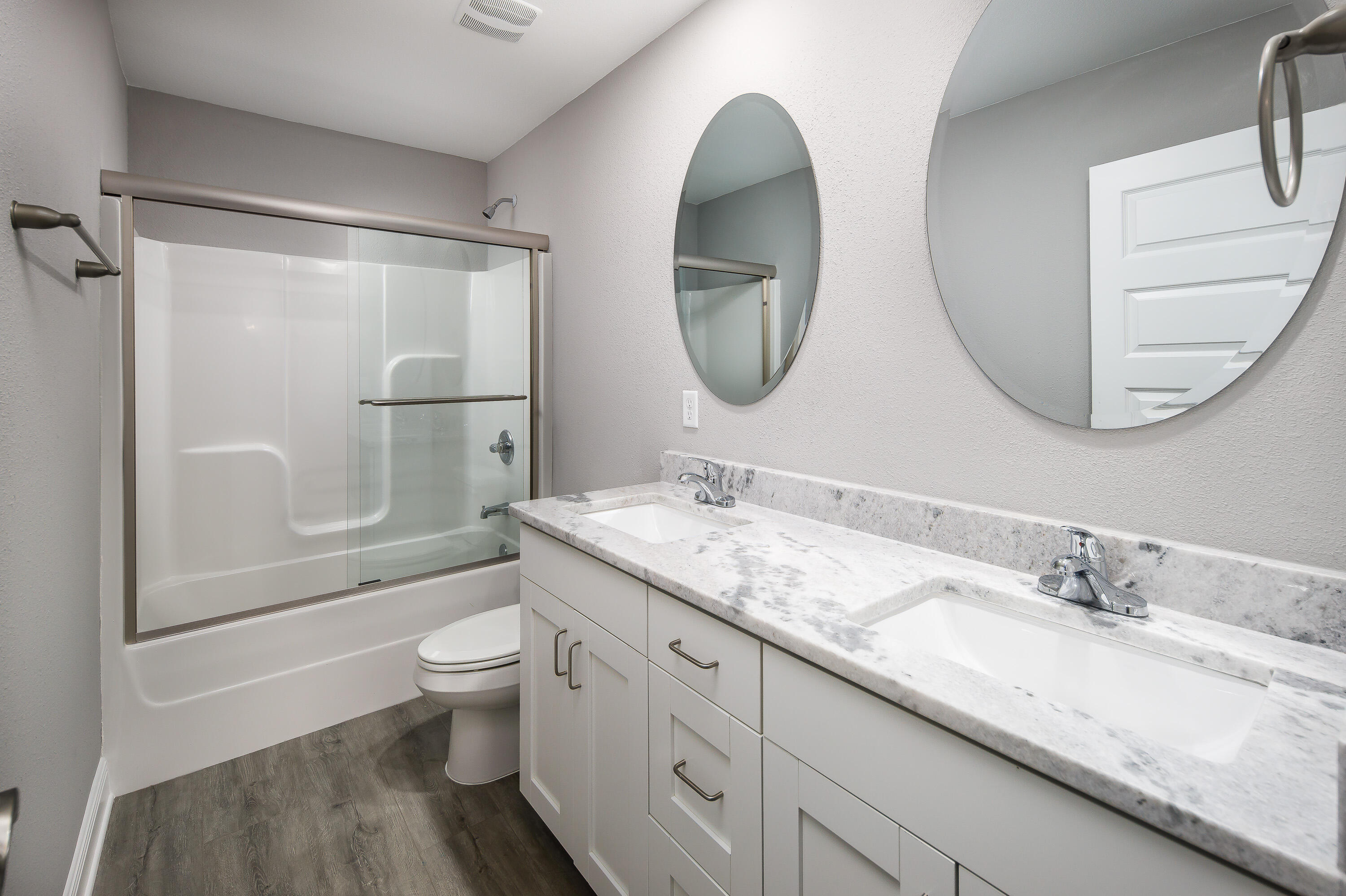 997 Skylark Road Mary Esther, FL 32569 - Photo 35 of 41 a bathroom with a granite countertop toilet sink and mirror