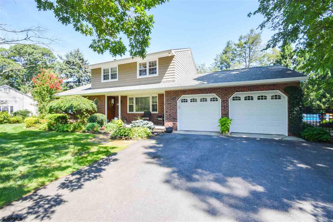 2021 Cedar Bridge Road Northfield, NJ 08225 - Photo 1 of 1 a front view of a house with garden