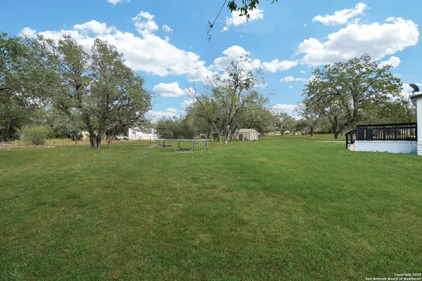 a view of a golf course with a lake view