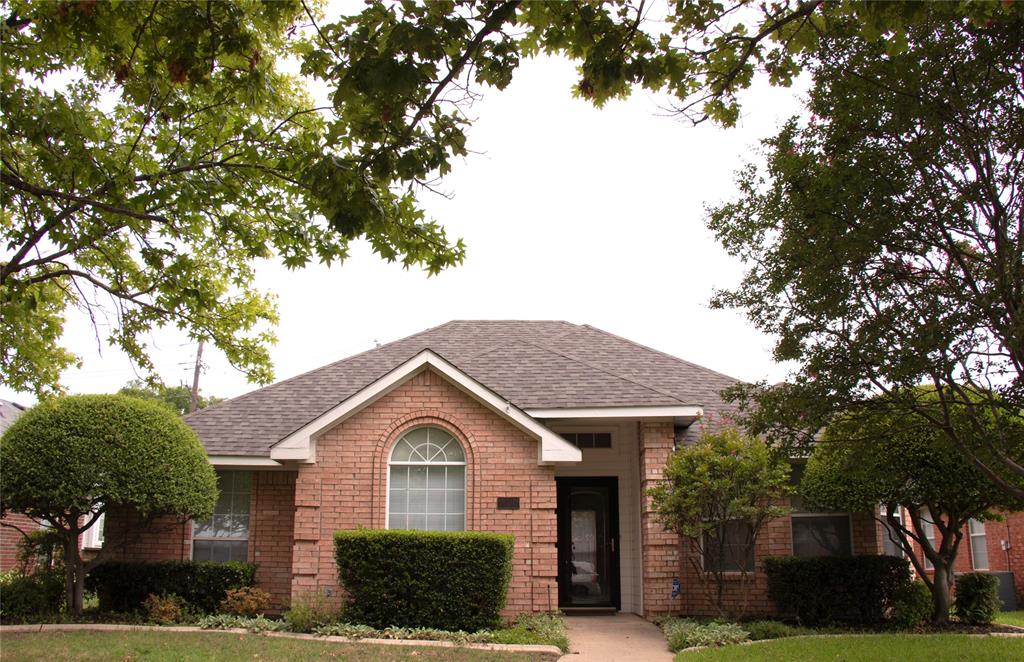 10702 Huntington Road Frisco, TX 75035 - Photo 1 of 23 a front view of a house with a yard