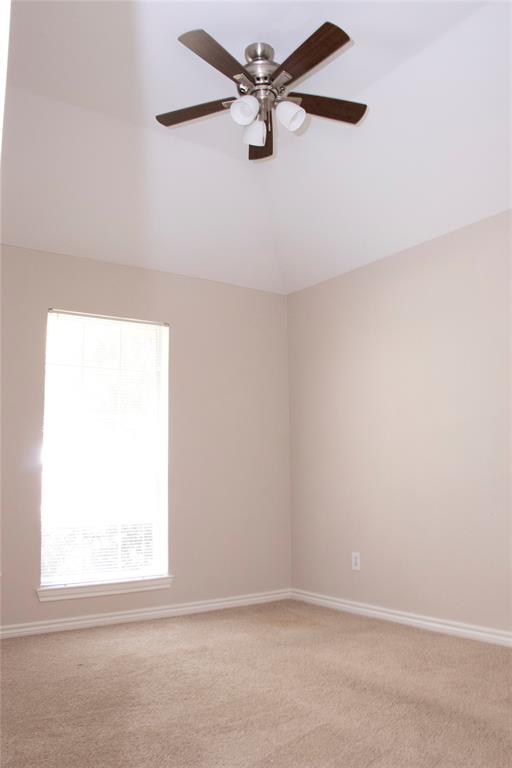 10702 Huntington Road Frisco, TX 75035 - Photo 14 of 23 an empty room with a window and a fan