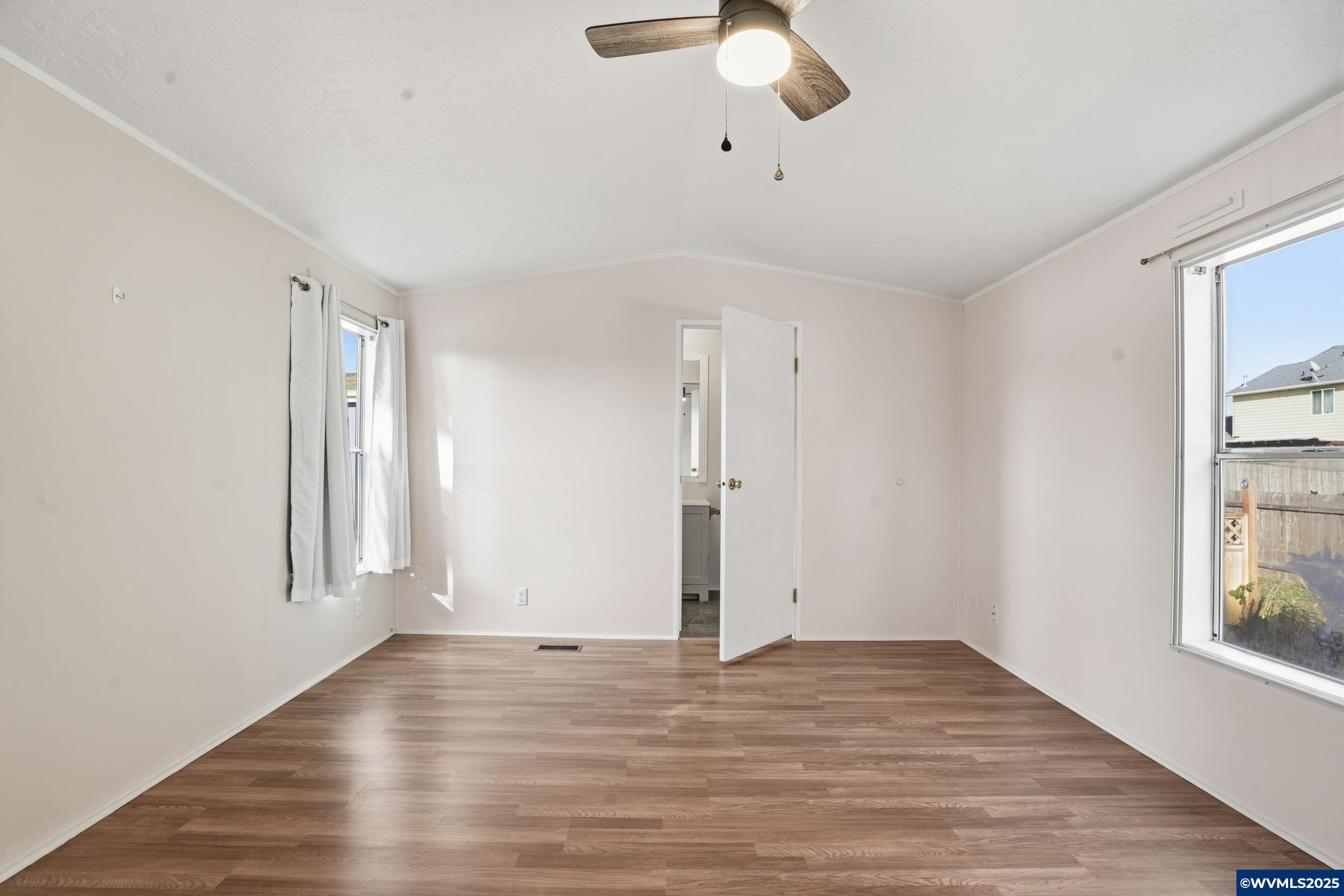 277 Edwards Road, Unit 145 Monmouth, OR 97361 - Photo 12 of 47 wooden floor in an empty room with a window