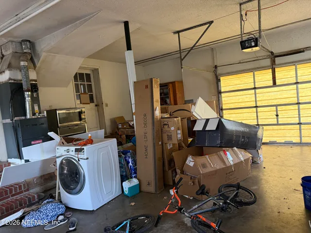 a picture of a living room with furniture and a fireplace