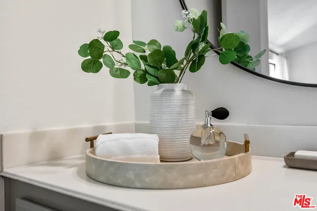a vase of flowers sitting on a dining table