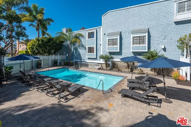 a front view of house with yard and outdoor seating