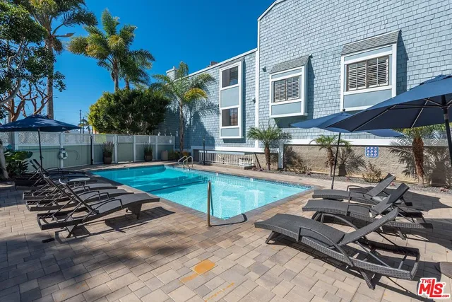 a view of a chairs and table in the patio