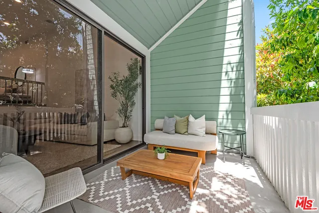 a outdoor living space with patio furniture and a potted plant