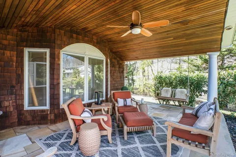 a dining room with furniture and a garden