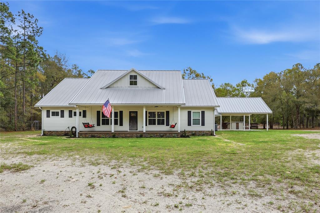 357 Southwest Conestoga Way Fort White, FL 32038 - Photo 1 of 44 front view of a house with a yard