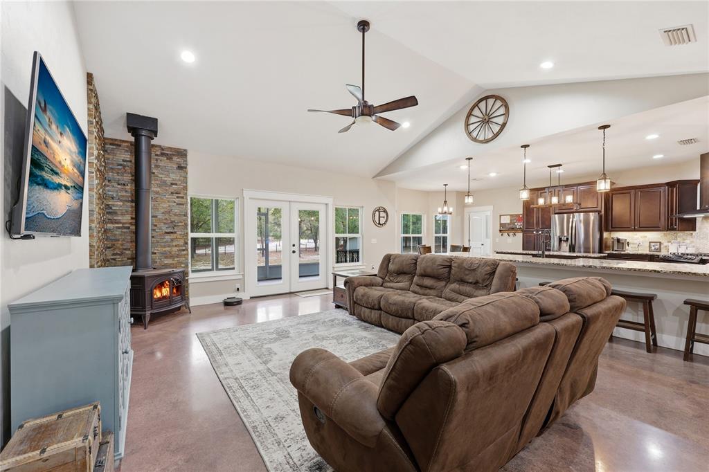 357 Southwest Conestoga Way Fort White, FL 32038 - Photo 15 of 44 a living room with furniture kitchen view and a large window