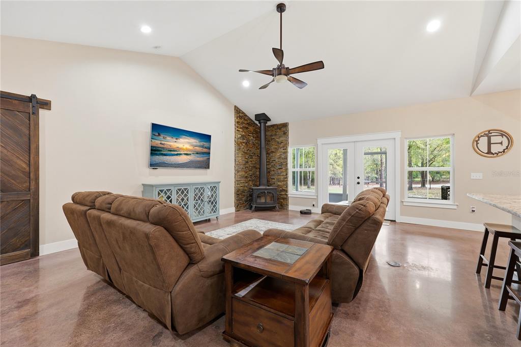 357 Southwest Conestoga Way Fort White, FL 32038 - Photo 16 of 44 a living room with furniture and a chandelier