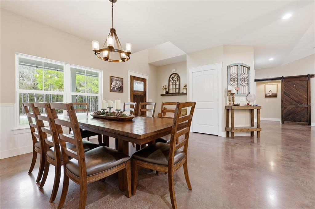 357 Southwest Conestoga Way Fort White, FL 32038 - Photo 18 of 44 a view of a dining room with furniture window and wooden floor