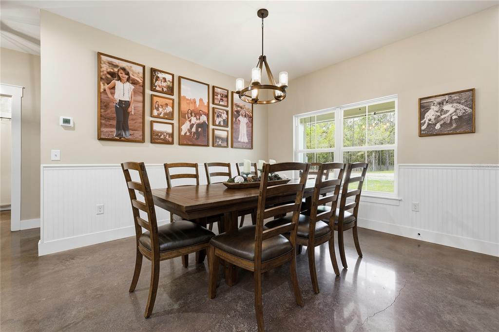 357 Southwest Conestoga Way Fort White, FL 32038 - Photo 19 of 44 a view of a dining room with furniture window and wooden floor