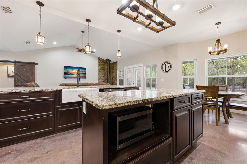 357 Southwest Conestoga Way Fort White, FL 32038 - Photo 20 of 44 a kitchen with a stove and a wooden floor