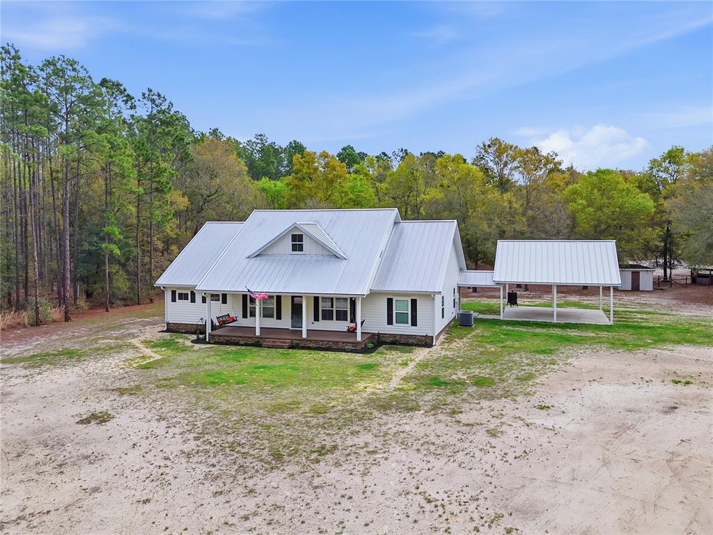 357 Southwest Conestoga Way Fort White, FL 32038 - Photo 2 of 44 a view of a house with a yard and sitting area
