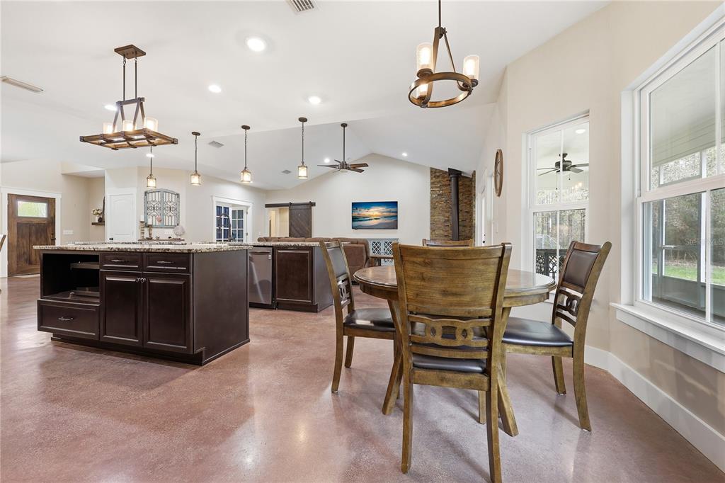 357 Southwest Conestoga Way Fort White, FL 32038 - Photo 22 of 44 a view of a dining room with furniture