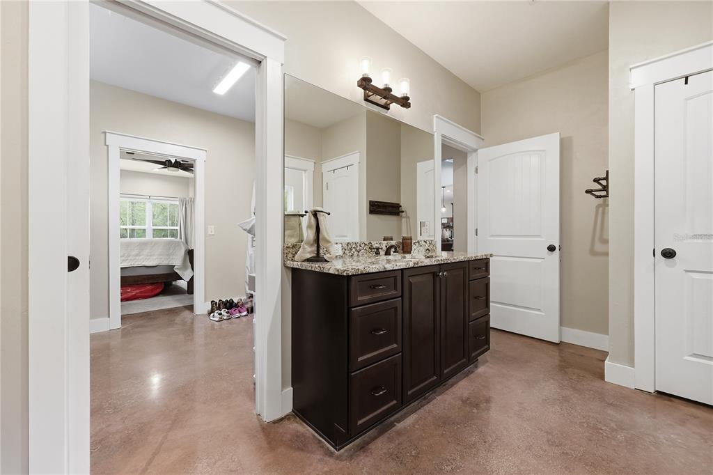 357 Southwest Conestoga Way Fort White, FL 32038 - Photo 27 of 44 a bathroom with a sink vanity and a mirror