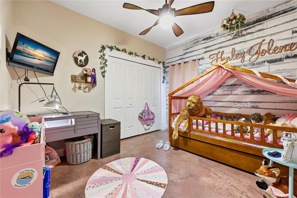 357 Southwest Conestoga Way Fort White, FL 32038 - Photo 28 of 44 a bedroom with furniture and a wooden floor