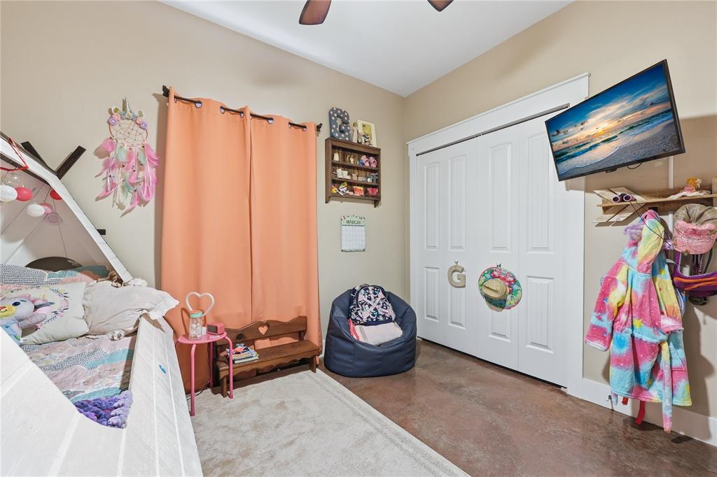 357 Southwest Conestoga Way Fort White, FL 32038 - Photo 29 of 44 a bedroom with a bed and a white cabinet