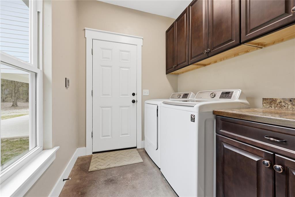 357 Southwest Conestoga Way Fort White, FL 32038 - Photo 32 of 44 a utility room with dryer and washer