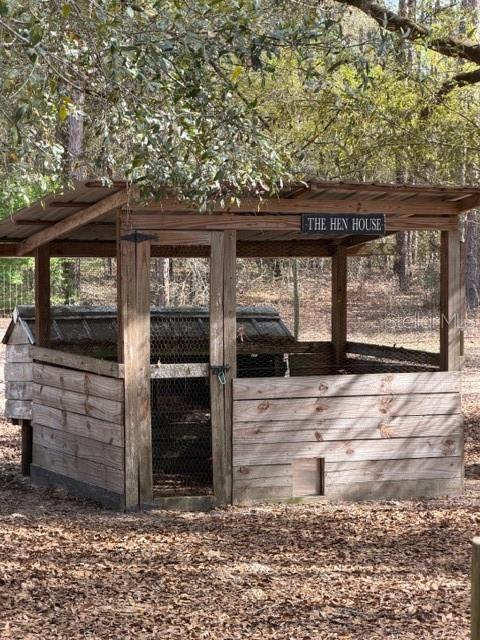 357 Southwest Conestoga Way Fort White, FL 32038 - Photo 40 of 44 a front view of a house with a garden