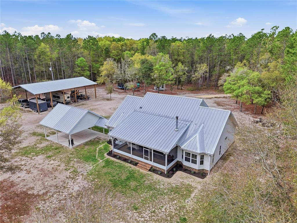 357 Southwest Conestoga Way Fort White, FL 32038 - Photo 9 of 44 an aerial view of a house with garden space and street view