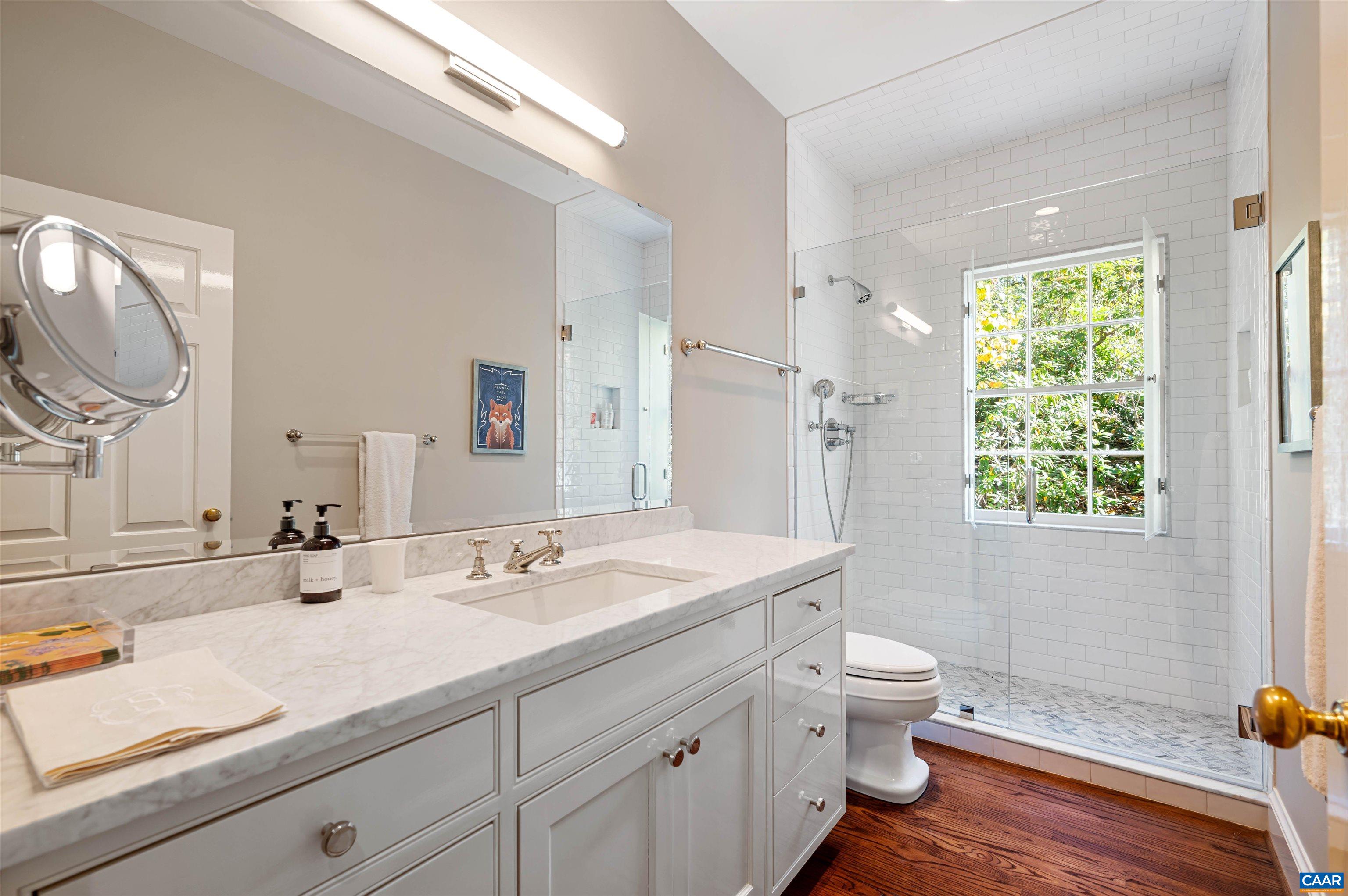 31 Old Farm Road Charlottesville, VA 22903 - Photo 34 of 62 a bathroom with a granite countertop toilet sink and a mirror