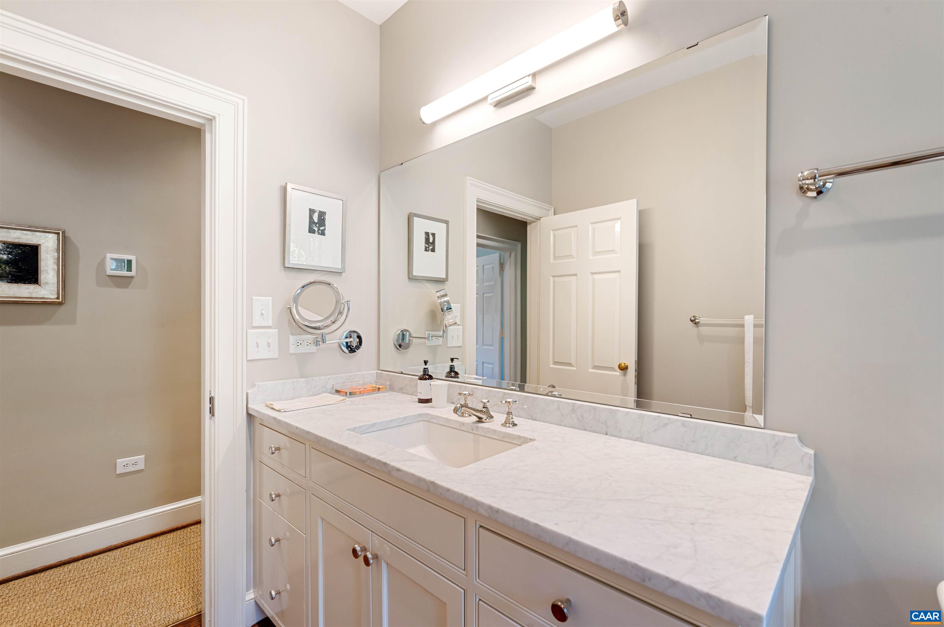 31 Old Farm Road Charlottesville, VA 22903 - Photo 35 of 62 a bathroom with a sink and a mirror