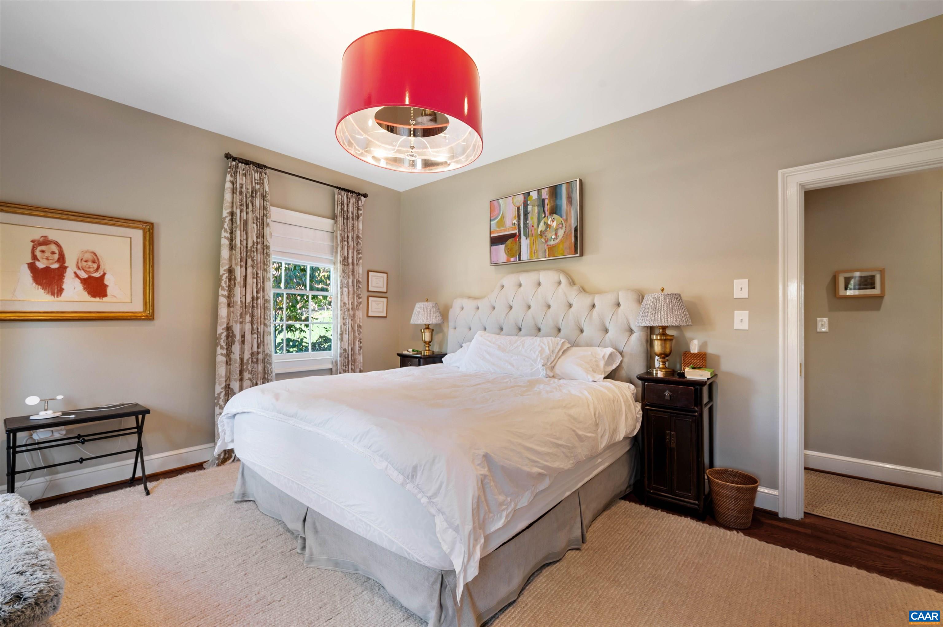 31 Old Farm Road Charlottesville, VA 22903 - Photo 44 of 62 a bedroom with a bed and a chandelier