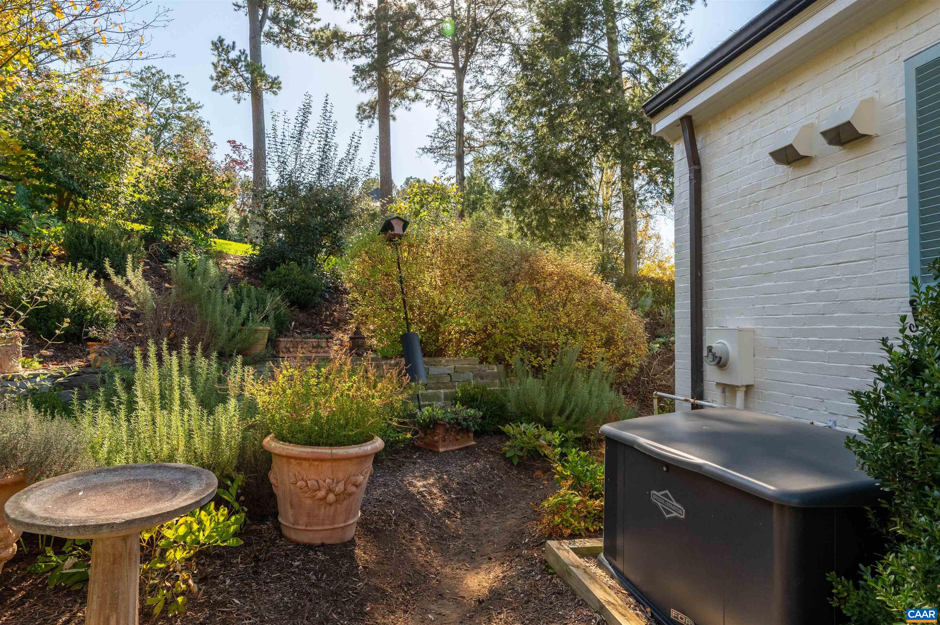31 Old Farm Road Charlottesville, VA 22903 - Photo 55 of 62 a view of a backyard with plants and fountain