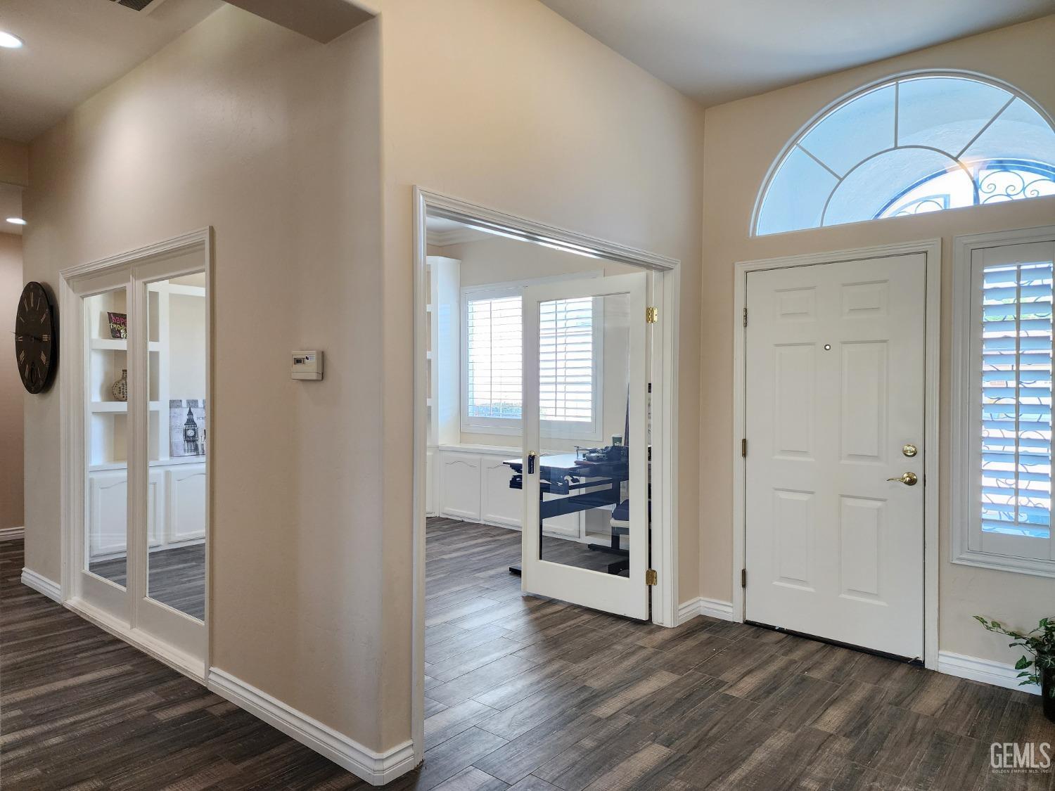 Undisclosed Address Bakersfield, CA 93312 - Photo 11 of 44 wooden floor in an empty room and a fireplace