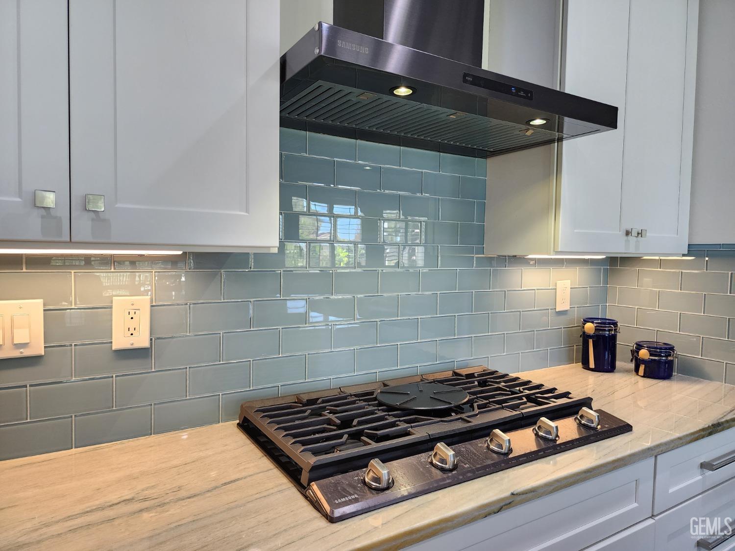 Undisclosed Address Bakersfield, CA 93312 - Photo 17 of 44 a stove top oven sitting inside of a kitchen