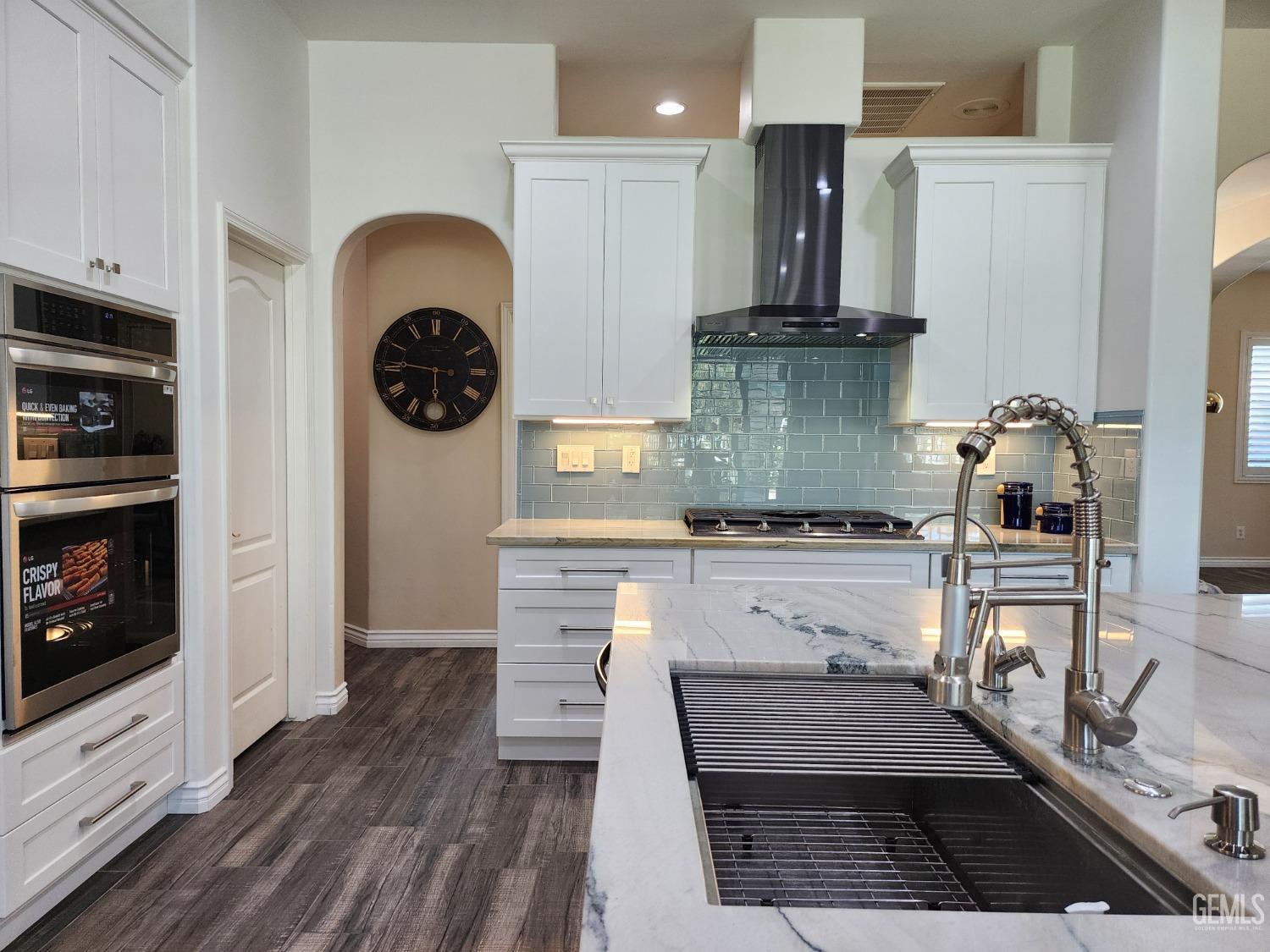 Undisclosed Address Bakersfield, CA 93312 - Photo 18 of 44 a kitchen with a refrigerator and fireplace