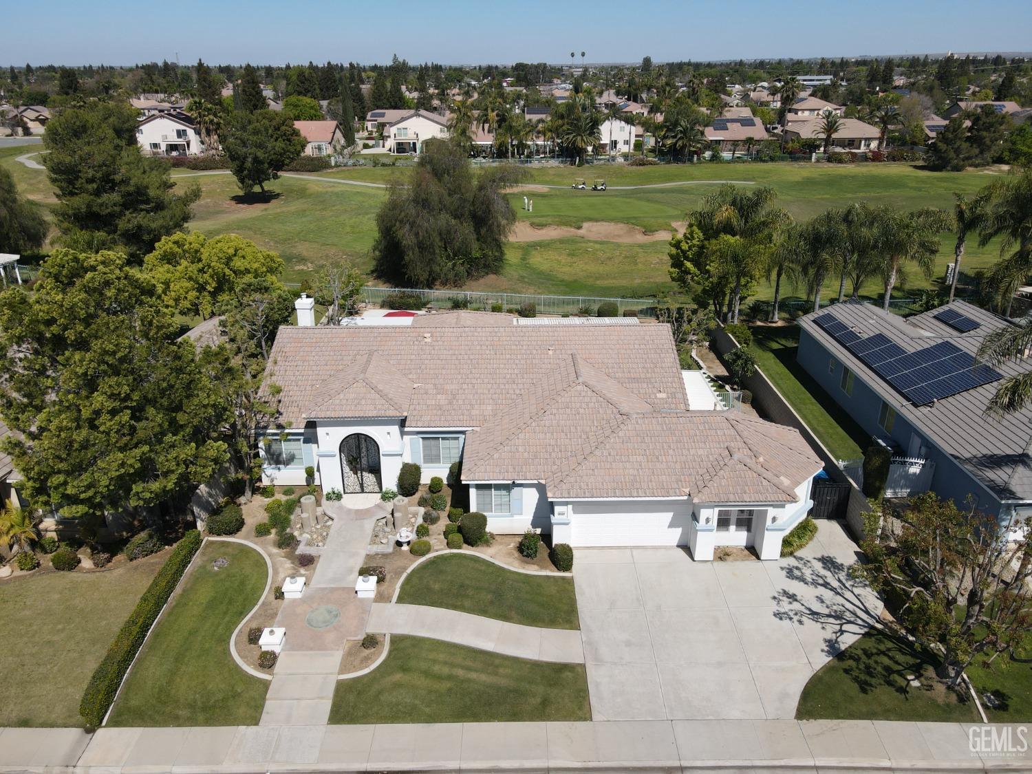Undisclosed Address Bakersfield, CA 93312 - Photo 2 of 44 an aerial view of a house with garden space lake view and mountain view