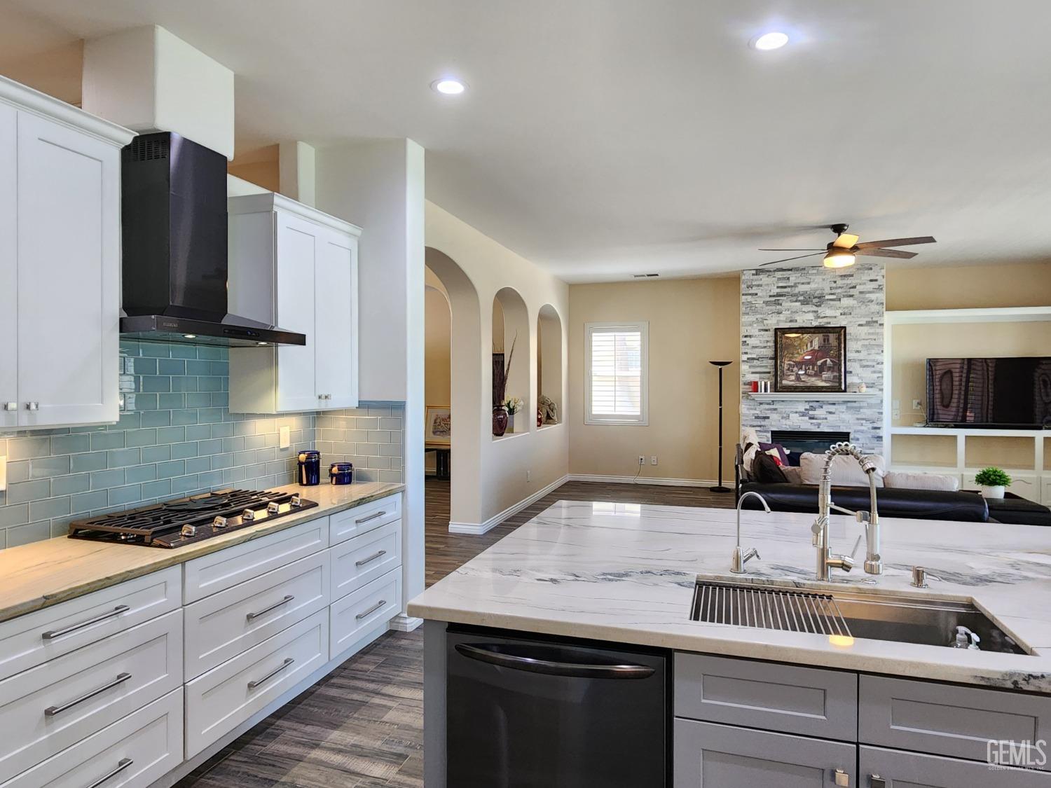 Undisclosed Address Bakersfield, CA 93312 - Photo 21 of 44 a kitchen with granite countertop a sink and cabinets