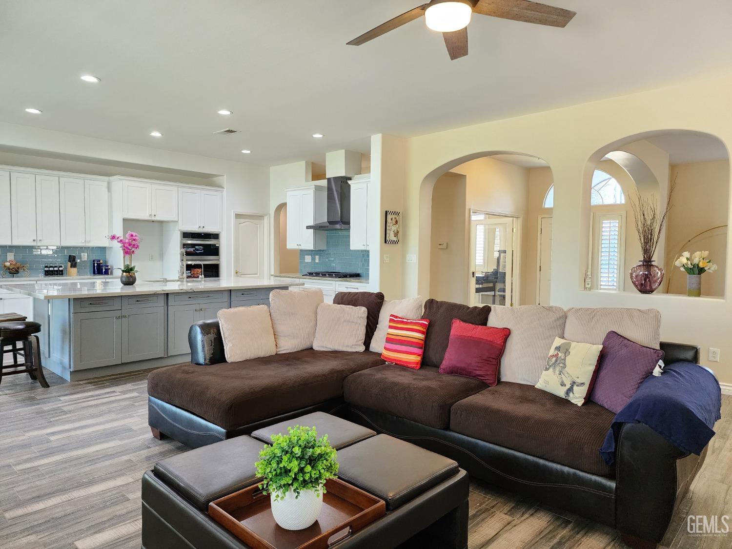 Undisclosed Address Bakersfield, CA 93312 - Photo 22 of 44 a living room with furniture kitchen and a chandelier
